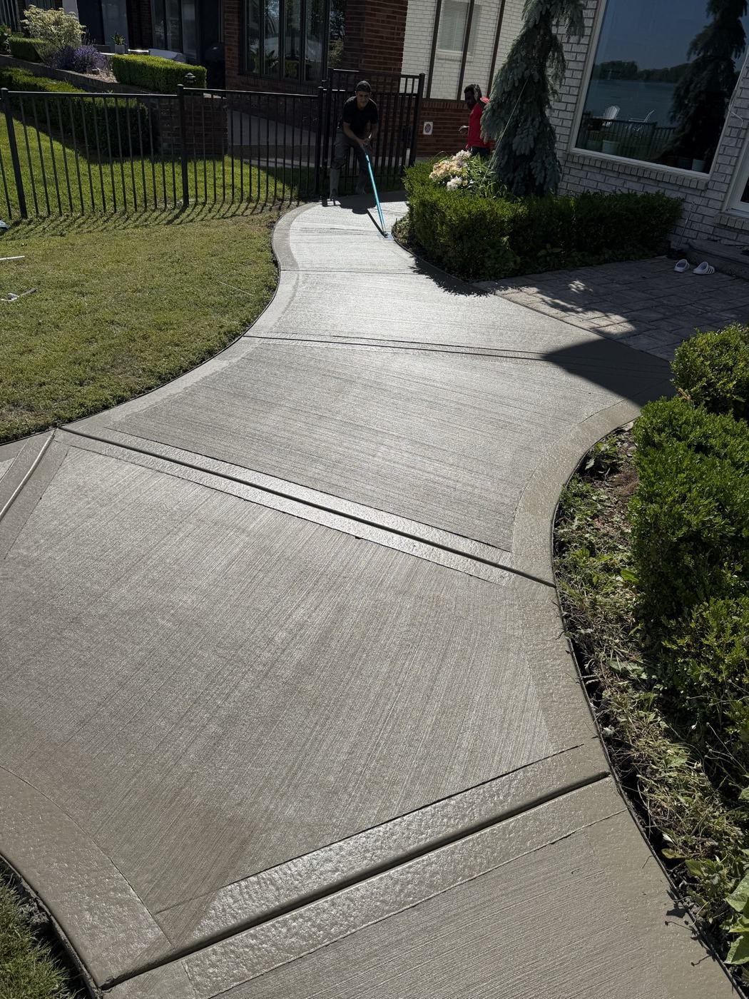 Curved broom finish concrete walkway