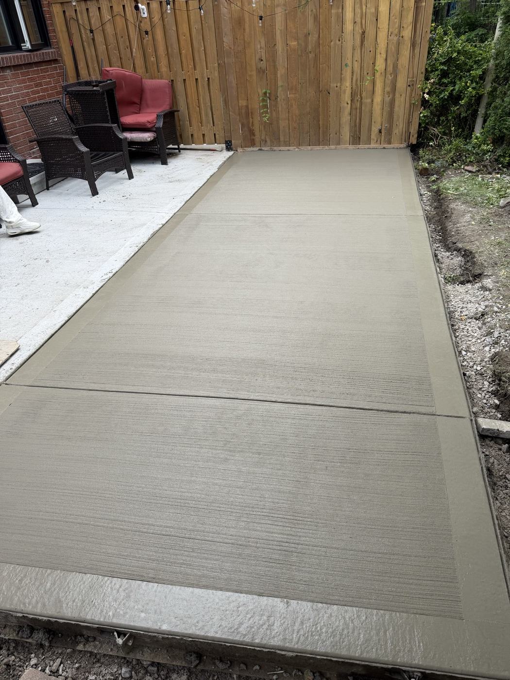 Fresh backyard concrete pad